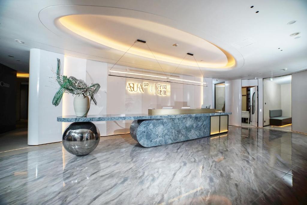 Posezení v ubytování Xin'an Yihao Hotel - Near Xiamen Railway Station, near Vientiane City, minibar is free
