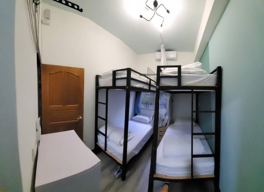Postel nebo postele na pokoji v ubytování 稻薌食旅民宿Daoxiang Travel