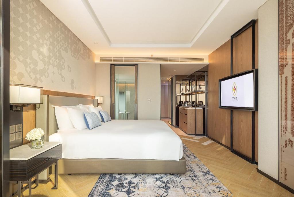 Postel nebo postele na pokoji v ubytování Eastin Grand Hotel Phayathai