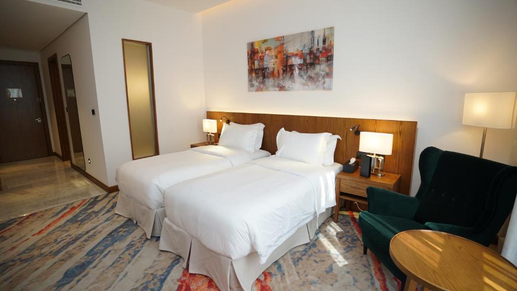 Voodi või voodid majutusasutuse Jasmine Garden Hotel toas