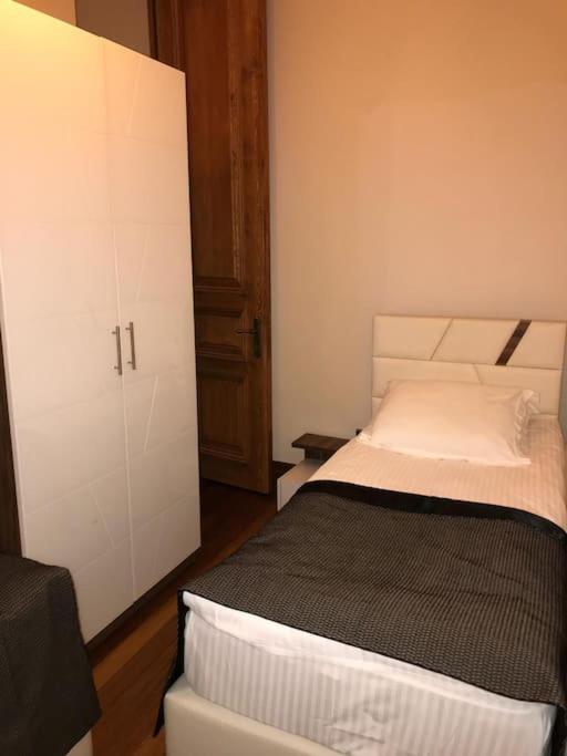 Postel nebo postele na pokoji v ubytování Aslan Residence