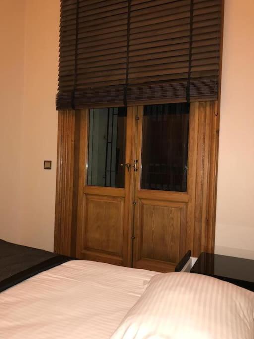 Postel nebo postele na pokoji v ubytování Aslan Residence