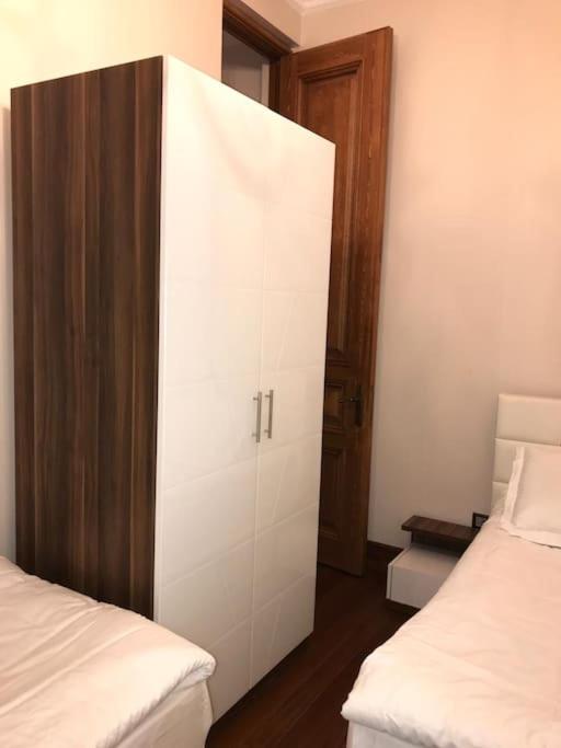 Postel nebo postele na pokoji v ubytování Aslan Residence
