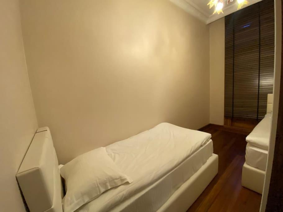 Postel nebo postele na pokoji v ubytování Aslan Residence