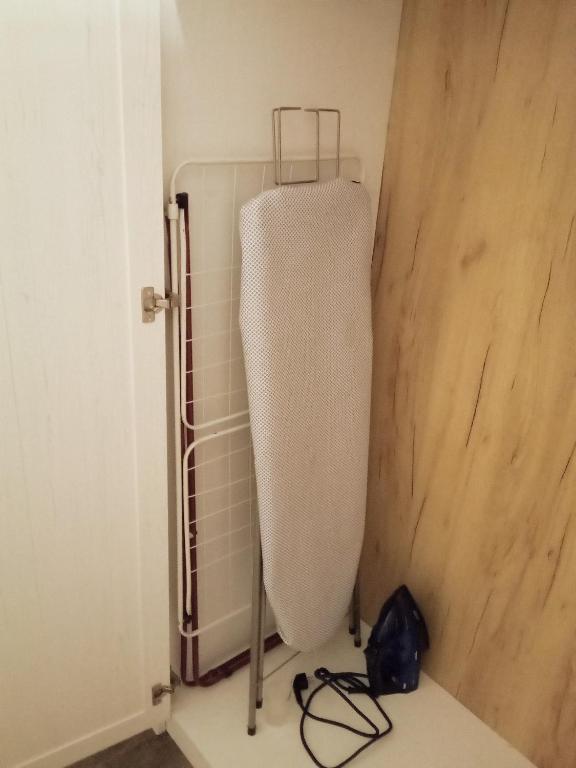a white radiator in a corner of a room at Hungaricum Budapest in Budapest