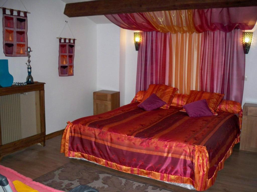 a bedroom with a large bed in a room at Marrakech Guest Room in the heart of the vineyard in Badens