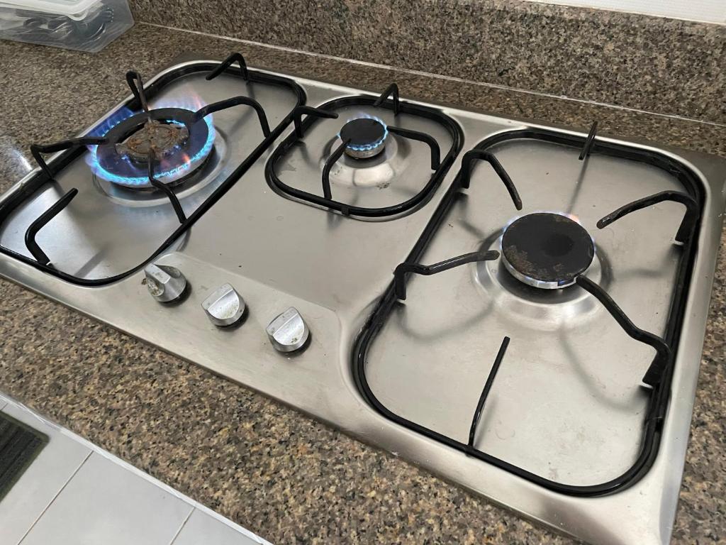 a white stove top oven sitting on top of a counter at 103/24 Kathu Waterfall in Phuket Town