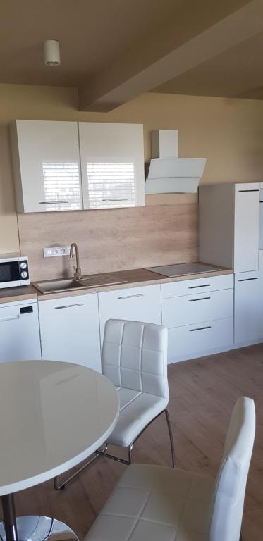 Kuchyň nebo kuchyňský kout v ubytování Apartmán Greenside