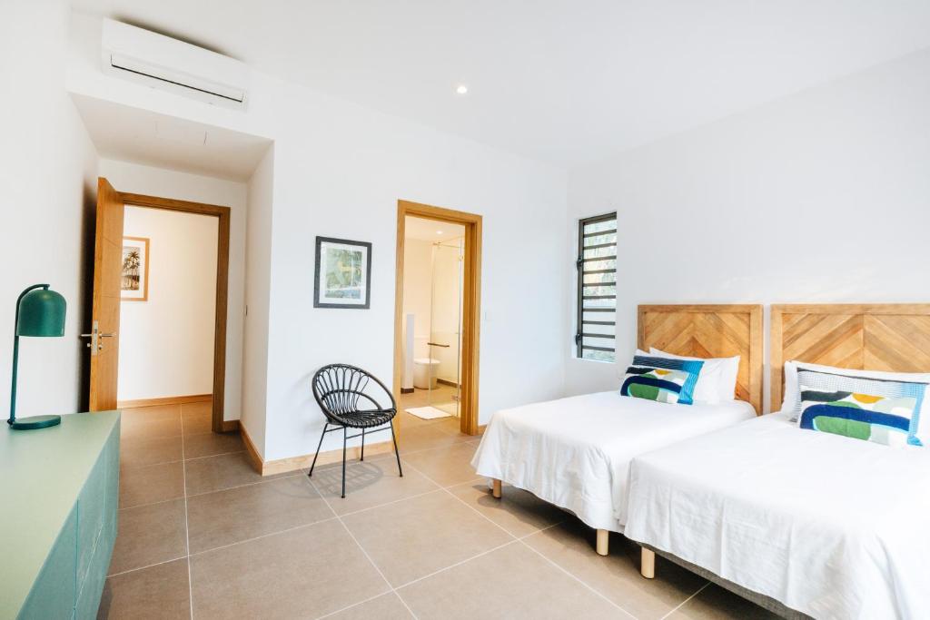 Postel nebo postele na pokoji v ubytování Mythic Suites & Villas by MJ Holidays
