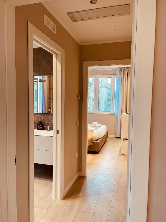a bedroom with a bed and a mirror at Urban Chic Home in Bari