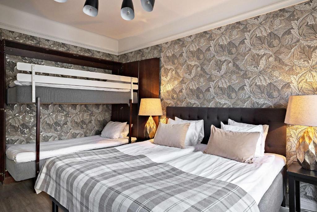Postel nebo postele na pokoji v ubytování Centric Hotel