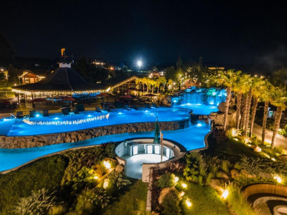 a view of a water park at night at Bourbon Serra Gaúcha Divisa Resort in São Francisco de Paula