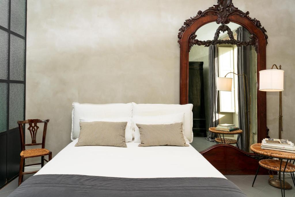 A bed or beds in a room at San Giuseppe Luxury Apartment