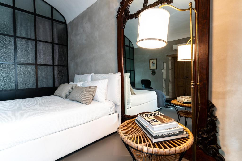 A bed or beds in a room at San Giuseppe Luxury Apartment