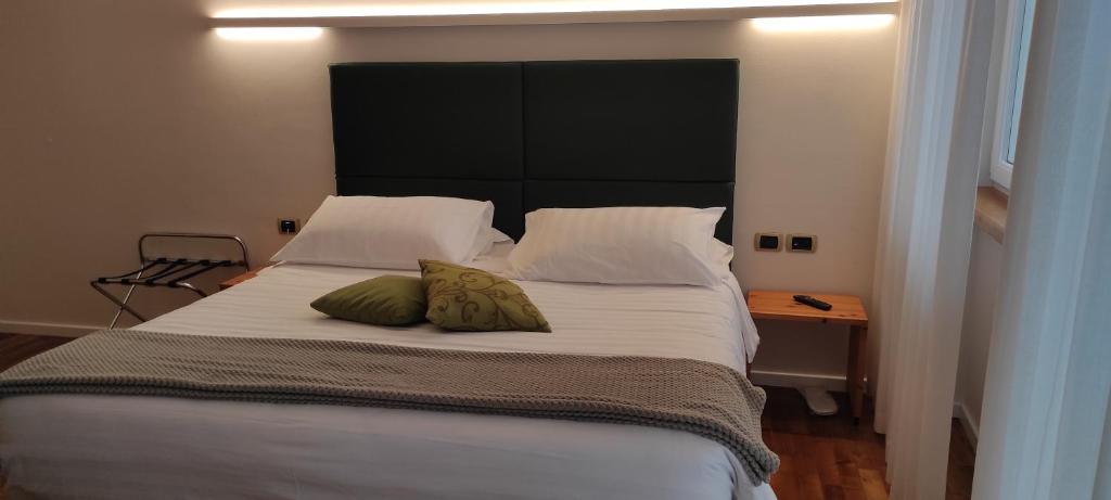 Postel nebo postele na pokoji v ubytování Hotel Lilla'