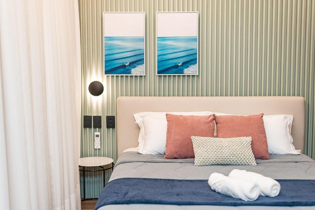 Ένα ή περισσότερα κρεβάτια σε δωμάτιο στο Studio Maravilhoso em Itapoã