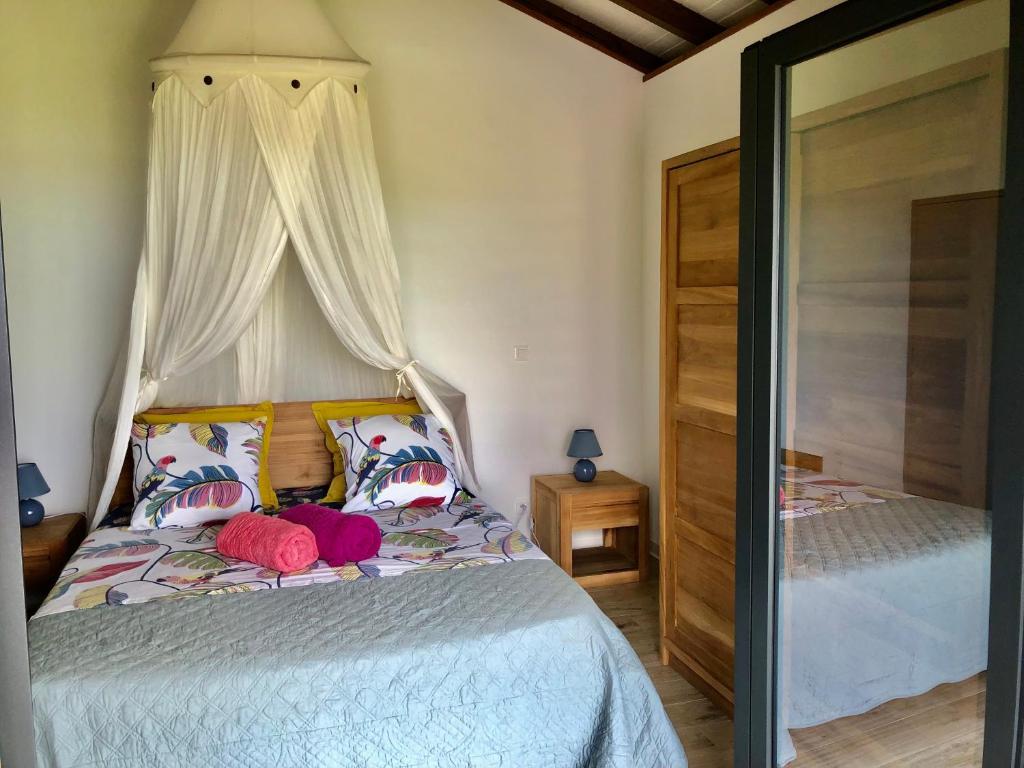 Postel nebo postele na pokoji v ubytování Calypso Bay