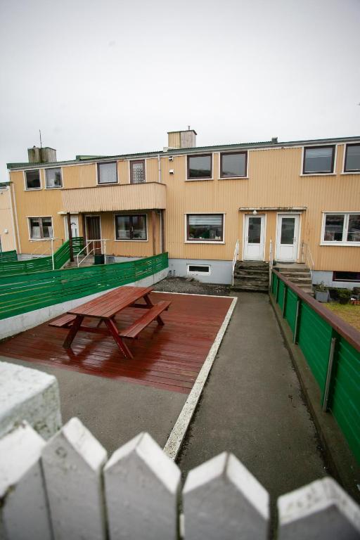a picnic table in front of a building at 2BR Apt / Central / Tórshavn in Tórshavn