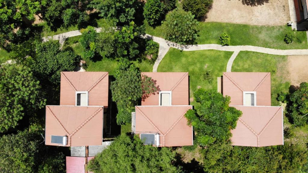 an overhead view of a house with pink roofs at Sigiri Arana Luxury Chalets in Sigiriya