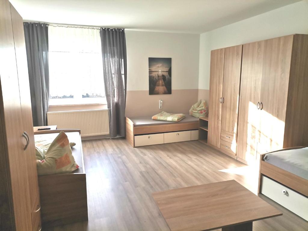Postel nebo postele na pokoji v ubytování BOARDINGHOUSE ORANIENBURG