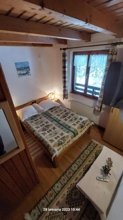 Postel nebo postele na pokoji v ubytování Pensiunea DANA