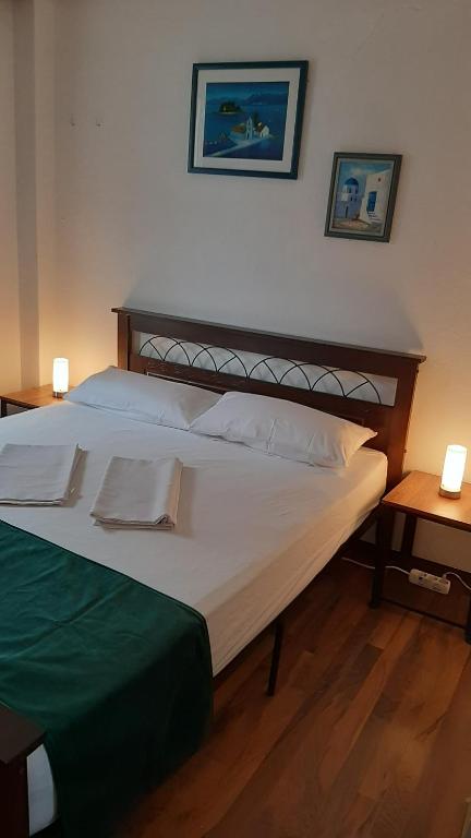 Postel nebo postele na pokoji v ubytování Dennis Apartment