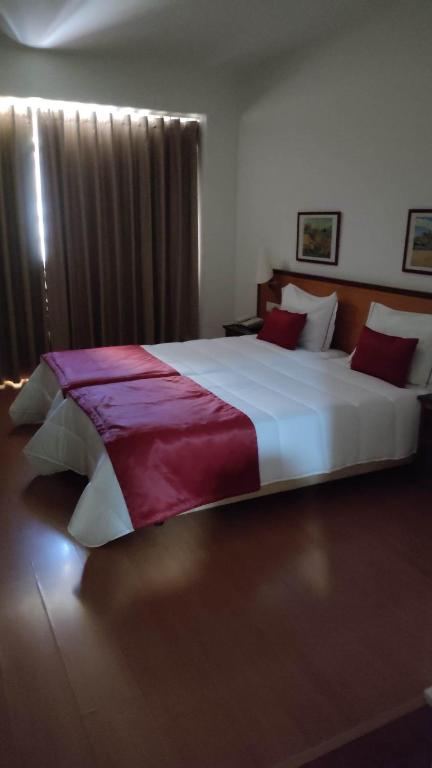 Postel nebo postele na pokoji v ubytování Hotel Dom Vilas