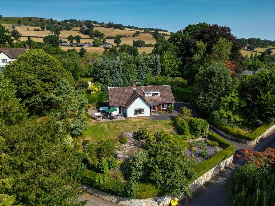an aerial view of a house in the countryside at Little Acre, a spacious hidden gem with hot tub in Kington