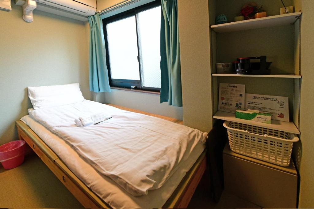 Lova arba lovos apgyvendinimo įstaigoje Jing House akihabara Ryokan - Vacation STAY 30887v
