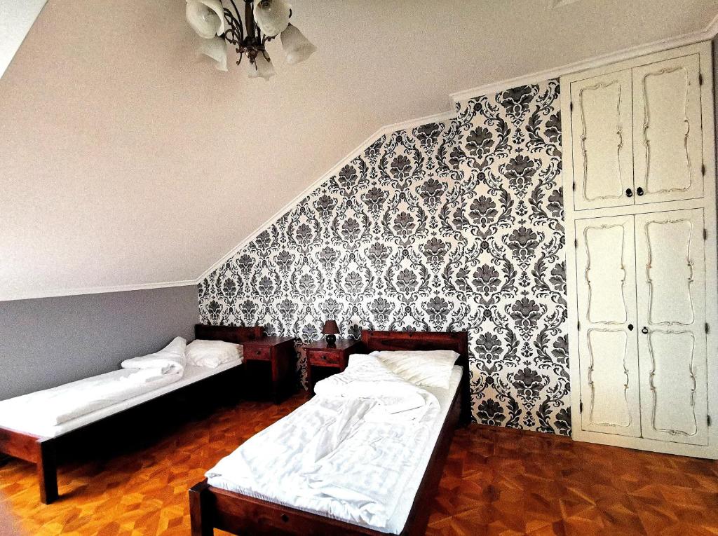 Posteľ alebo postele v izbe v ubytovaní Villa Wellness