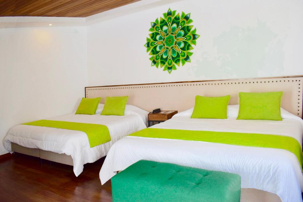 Postel nebo postele na pokoji v ubytování Sangay Spa Hotel