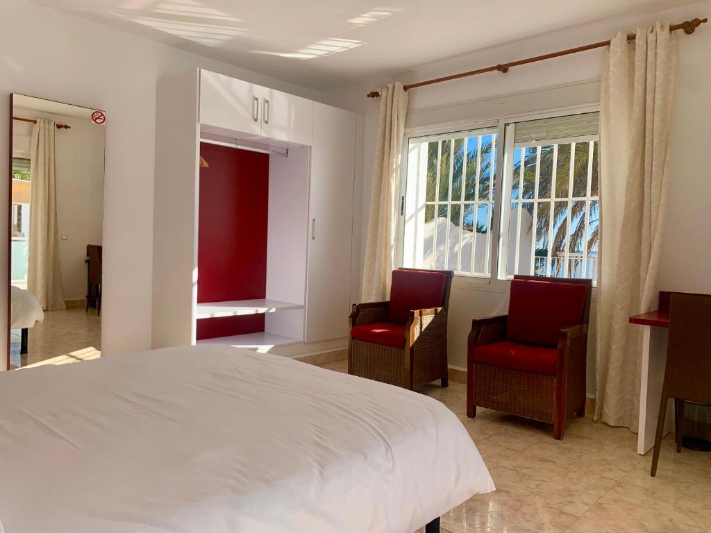 Postel nebo postele na pokoji v ubytování Hospedium Hotel Continental