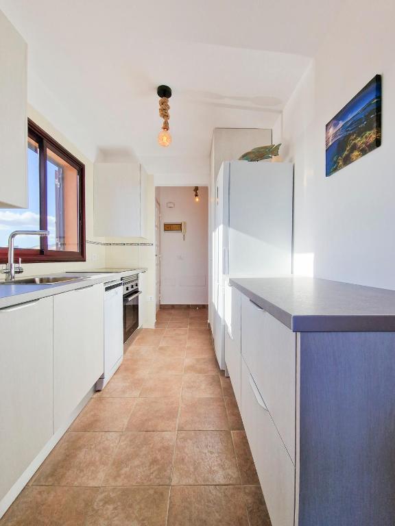 Kuchyň nebo kuchyňský kout v ubytování MEDANO4YOU The Ocean Terrace Penthouse