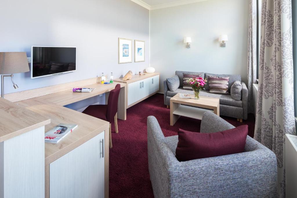 TV a/nebo společenská místnost v ubytování Strandvilla an der Kaiserwiese