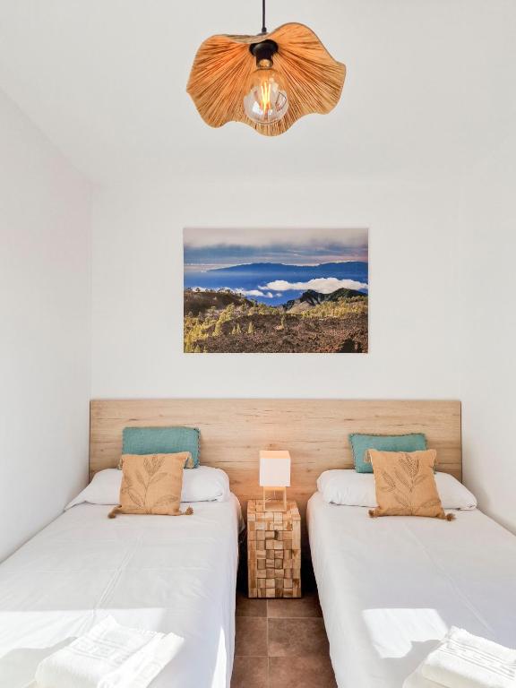 Postel nebo postele na pokoji v ubytování MEDANO4YOU The Ocean Terrace Penthouse