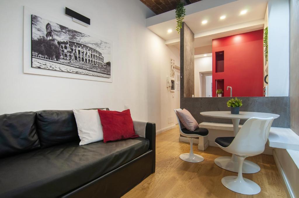 a living room with a couch and a table at Urbanflat Repubblica Square in Rome