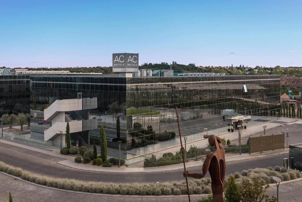 a statue of a woman standing in front of a building at AC Hotel La Finca by Marriott in Pozuelo de Alarcón