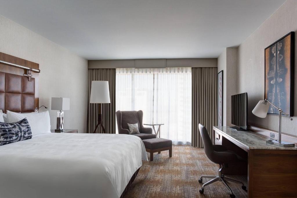 a hotel room with a bed and a desk at JW Marriott Austin in Austin