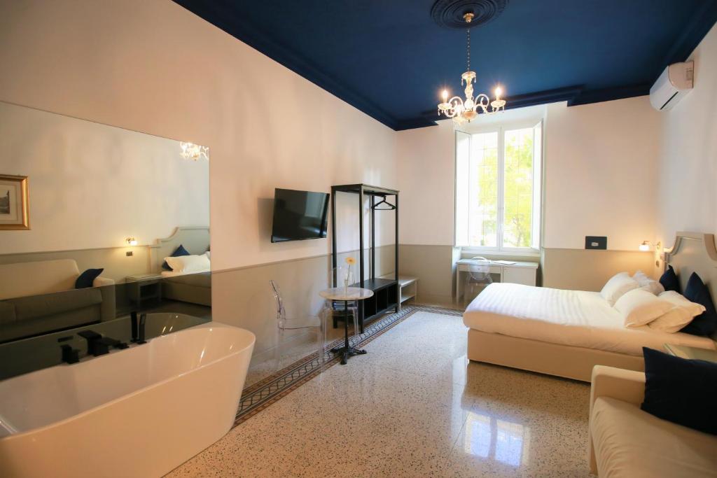 A television and/or entertainment centre at Duelle Vatican Suite