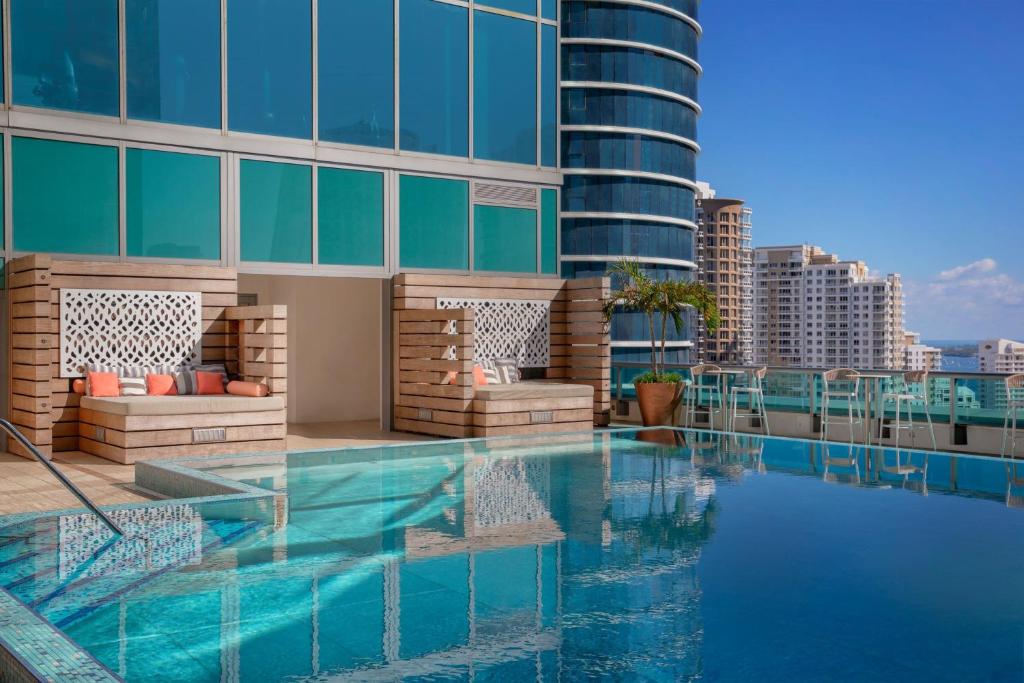 a swimming pool on the roof of a building at JW Marriott Marquis Miami in Miami