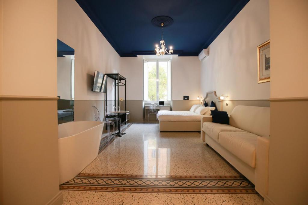 A bed or beds in a room at Duelle Vatican Suite