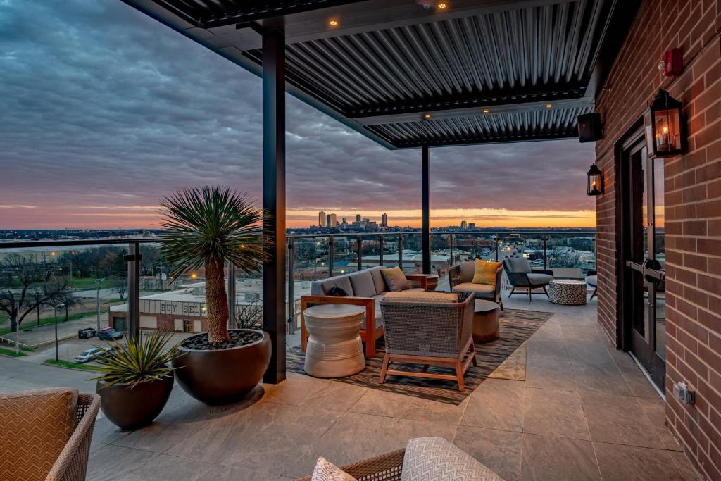 a patio with furniture and a view of the city at SpringHill Suites by Marriott Fort Worth Historic Stockyards in Fort Worth