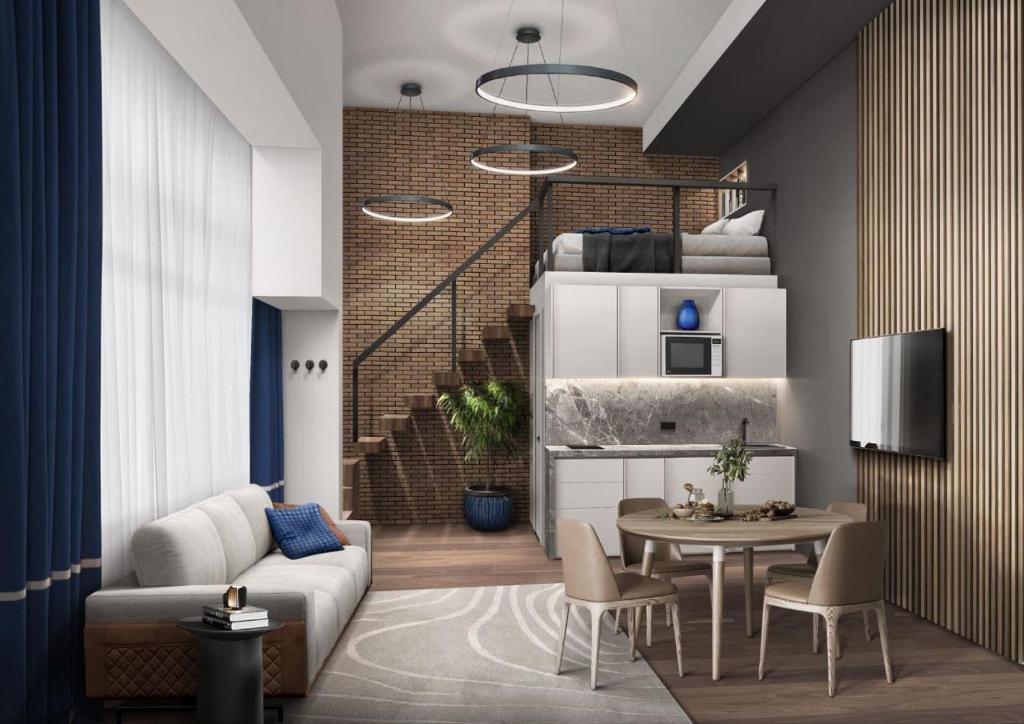 sala de estar con sofá y mesa en Hlius Brand New Apartments, en Valencia