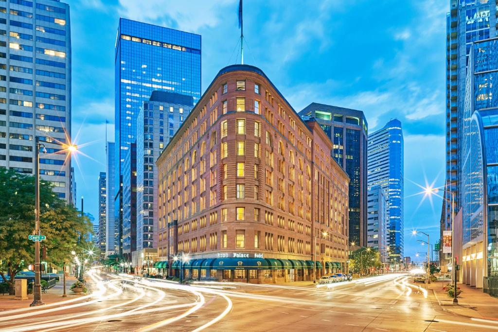 a building in a city with tall buildings at The Brown Palace Hotel and Spa, Autograph Collection in Denver