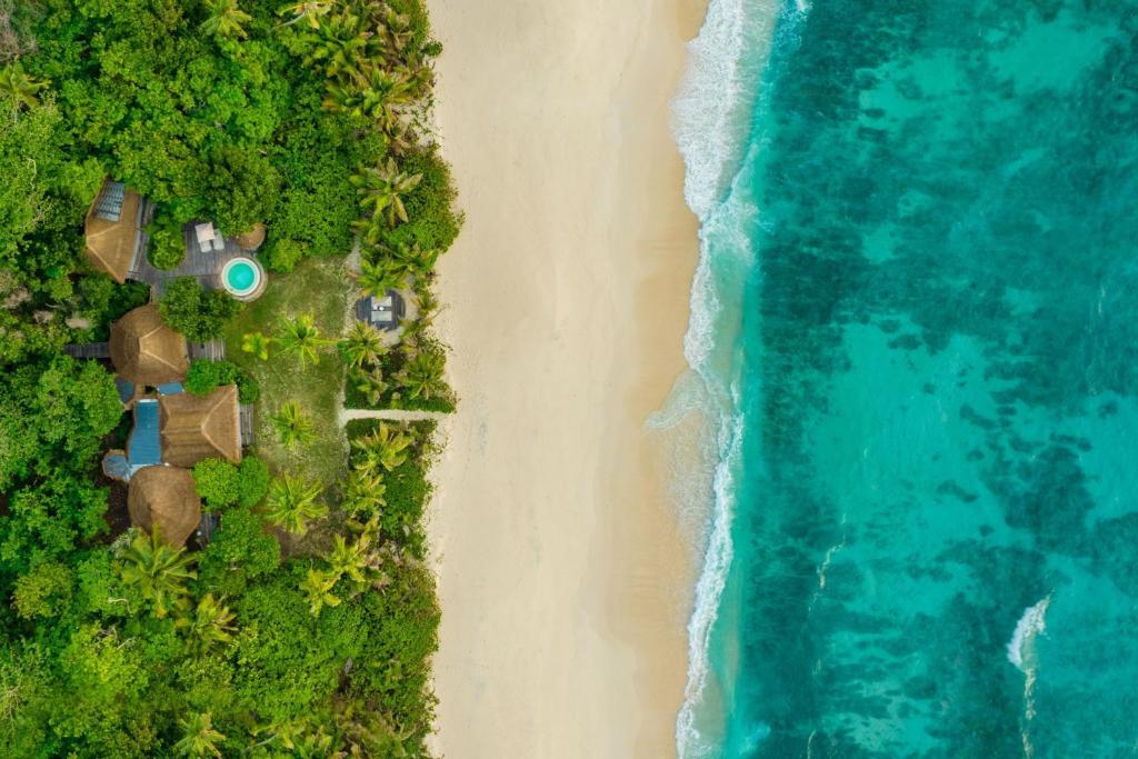 an overhead view of a beach and the ocean at North Island, a Luxury Collection Resort, Seychelles in North Island