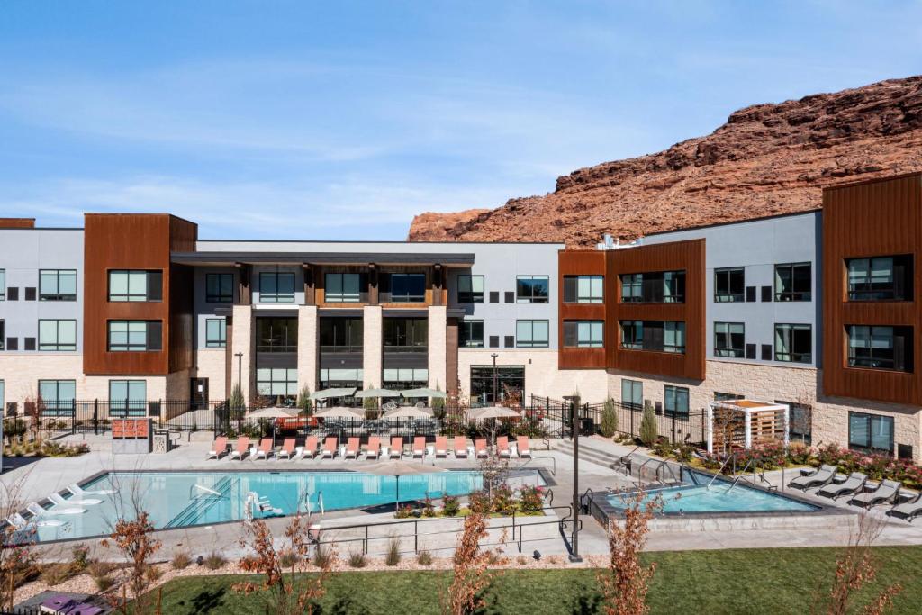 an exterior view of a hotel with a swimming pool at Element Moab in Moab