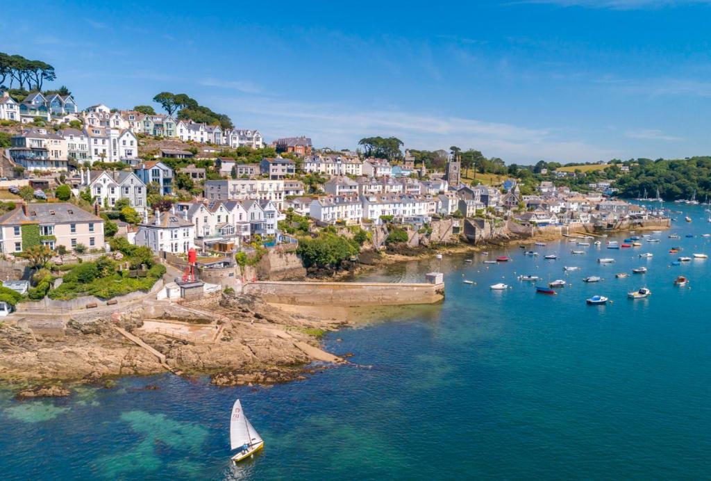 an aerial view of a town with boats in the water at Oystercatcher in Fowey