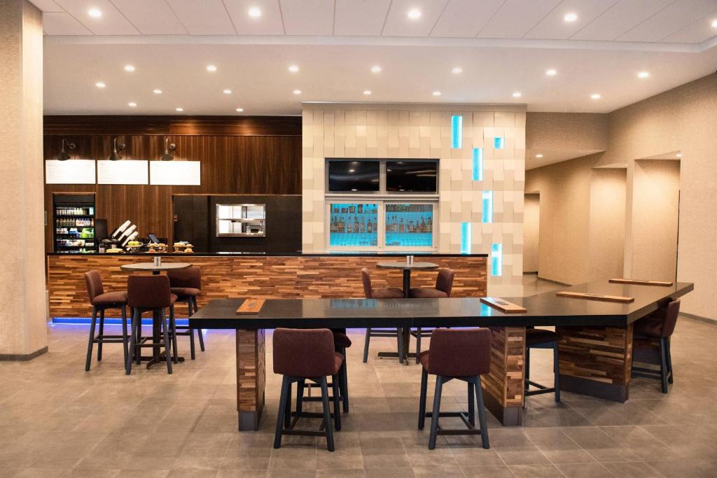 a large dining room with a large table and chairs at Courtyard by Marriott Mesa at Wrigleyville West in Mesa