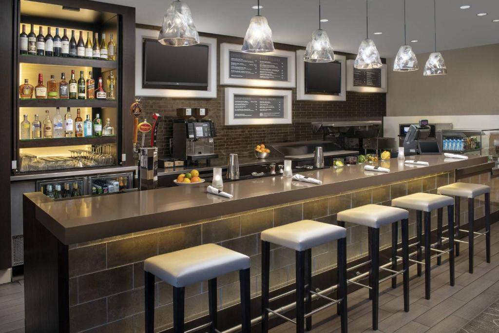 a bar in a restaurant with stools at Courtyard Tacoma Downtown in Tacoma