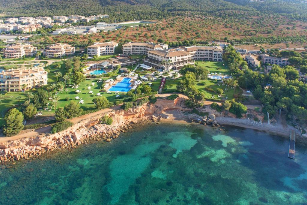 an aerial view of the resort and the water at The St. Regis Mardavall Mallorca Resort in Portals Nous